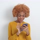 African young woman uses mobile phone, smartphone. - VideoHive Item for Sale