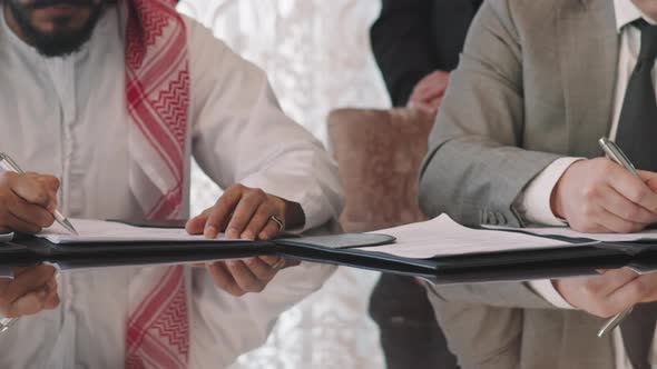 Unrecognizable Political Representatives Signing Agreement alt