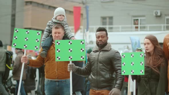 Crowd of Diverse People with Chromakey Banners Placards at Rally Demonstration alt