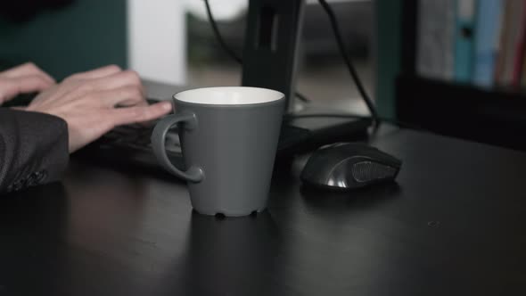 Entrepreneur Spills Coffee on Desk While Working alt