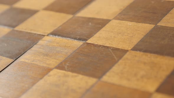 Tilting on ancient chess set table rows and columns close-up 4K 2160p 30fps UltraHD footage - Old bo alt