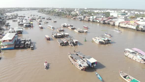 Aerial: rotating panorama over Cai Rang floating market Can Tho Vietnam alt