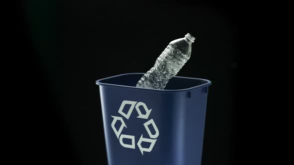 Tossing water bottle into trash can, Slow Motion alt