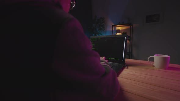 Woman Coding on Laptop