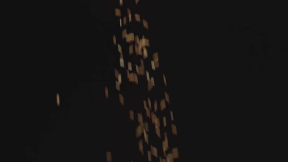 Dry Uncooked Brown Wild Rice Is Poured From Top To Bottom. Brown Grains Fall alt