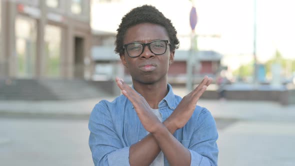 Rejecting Young African Man Doing No Gesture Outdoor alt
