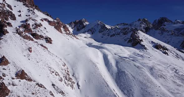 Snow Mountain Peaks with Rocks alt