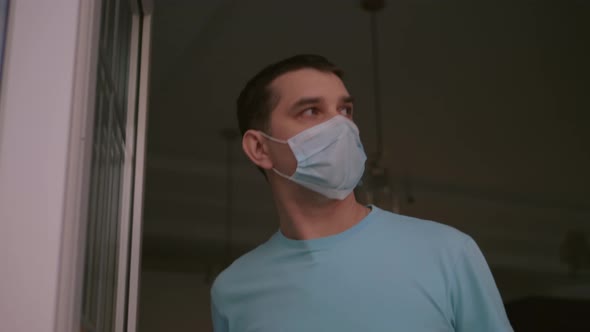 Man Takes Off Medical Mask and Takes Deep Breath