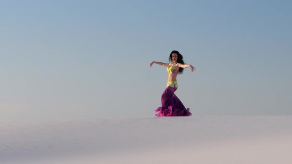 Graceful Dancer Against the Sky Dancing Belly Dance in a Brilliant Outfit alt