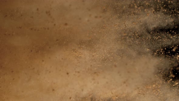 Super Slow Motion Shot of Side Makeup Powder Explosion Isolated on Black Background at 1000Fps alt