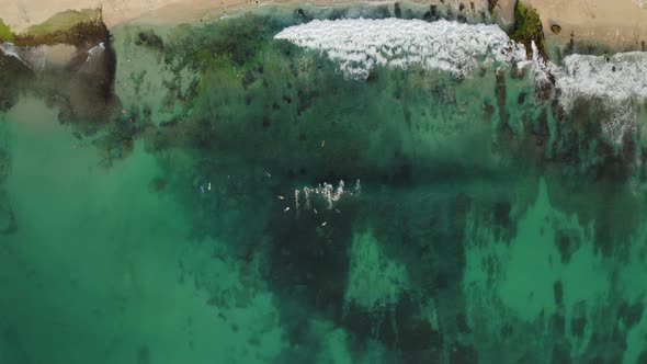 Aerial Drone Top Down View at Emerald Water at the Balinese Beach Indonesia alt