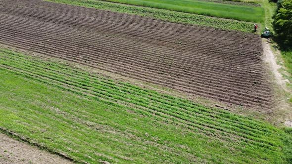 Aerial drone view of a flying over the rural agricultural landscape. alt