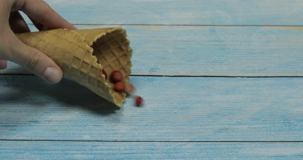 Berry Ice Cream. Berries of Strawberry in a Waffle on a Blue Wooden Background alt