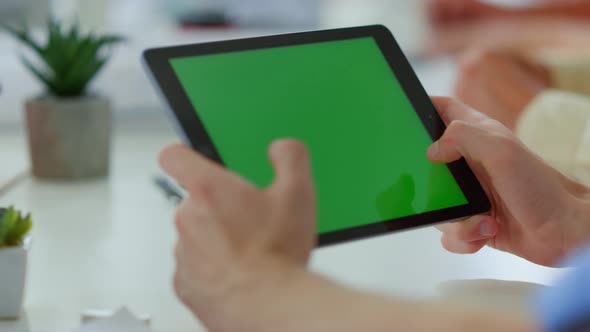 Male Hands Touching Green Screen Tablet Indoors alt