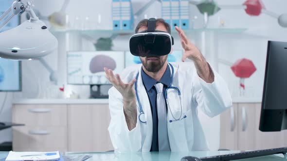 Neurologist Wearing VR Goggles Learning About Brain in 3D Space alt