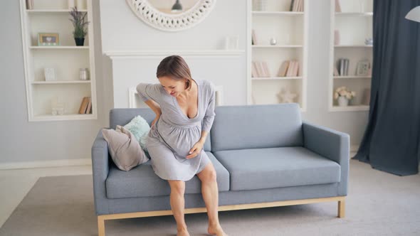 Pregnant Woman Having A Back Pain alt