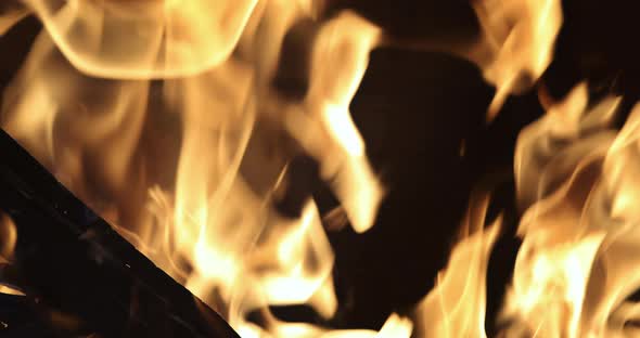 Home Fire Glowing Pieces in Fireplace with Burning Wood alt