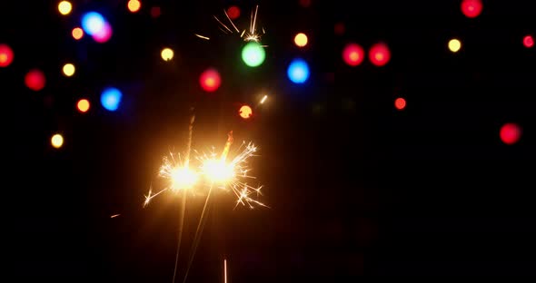 New Year's Sparklers Are Lit By Flames.