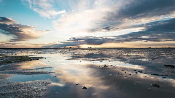 Isigny-Sur-Mer, France, Timelapse  - Reflection clip of the Baie des Veys before the Sunset alt