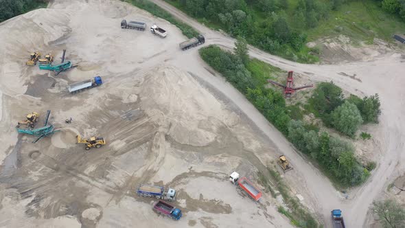 Mining conveyor at sand quarry. Aerial view of mining machinery. Mining industry alt