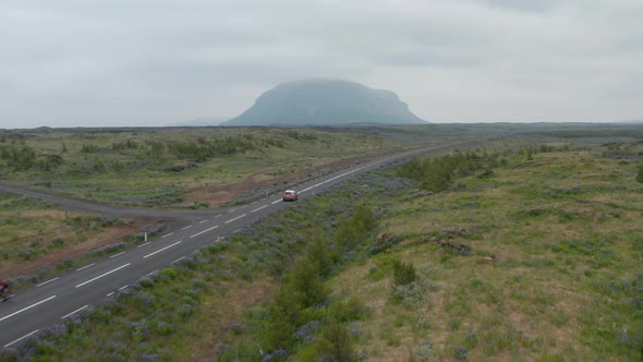 Birds Eye View Car Peacefully Driving on Ring Road the Most Important Highway in Iceland alt