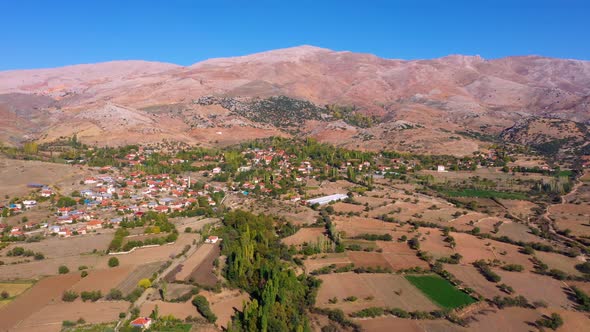Scenic Aerial View of Mountain Valley with Agricultural Fields alt