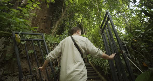 Following Pov Shot of Young White Male Walking Through the Iron Gates in an Ancient Ruins and alt