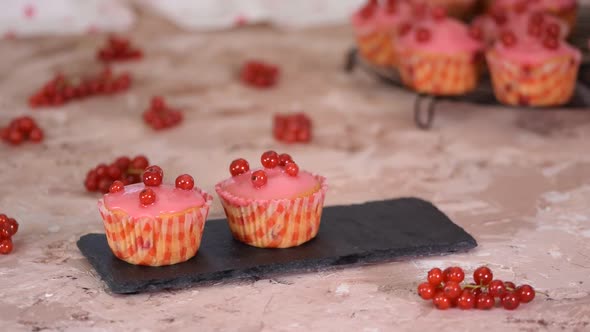 Tasty Muffins With Red Currants Berries And Sugar Glaze