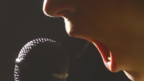 Woman singing to a microphone