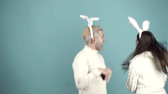 Easter Couple Jumping with Bunny Ears and Tail alt