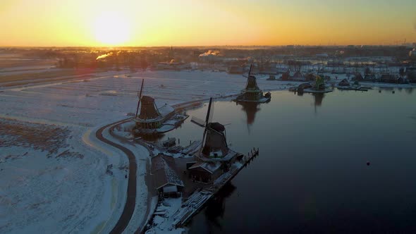 Wooden Wind Mill at the Zaanse Schans Windmill Village During Winter with Snowy Landscape Snow alt