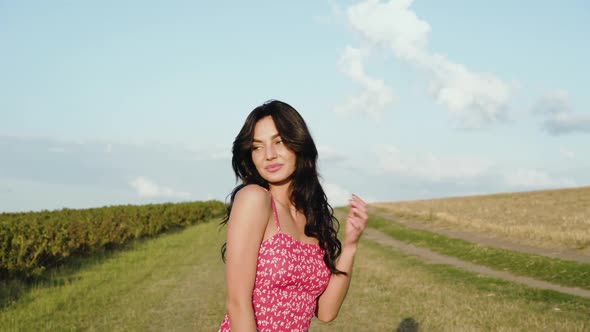 Attractive Brunette Lightly Flirting with Dress Tape at Camera alt