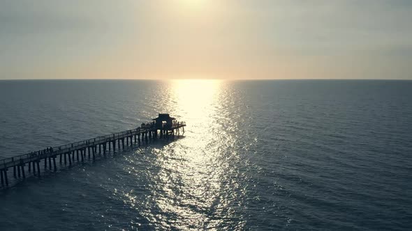Sunset Over Ocean or Sea, Drone Flying Above Pier