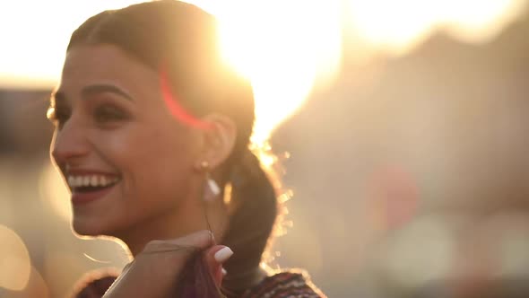 Adorable Young Happy Girl in Red Trendy Clothing Walking Outdoor Turning Around Looking at Camera