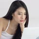 Beautiful asian young woman lying on bed using laptop at bedroom for leisure and relax. - VideoHive Item for Sale