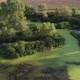 Flight Over A Beautiful Lake Dotted With Green Vegetation 20 - VideoHive Item for Sale