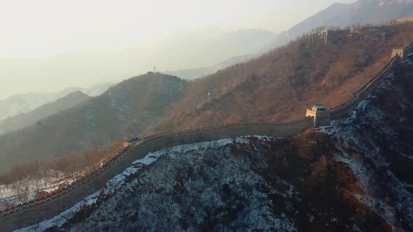 Flying Over China Great Wall in the Winter Sunset