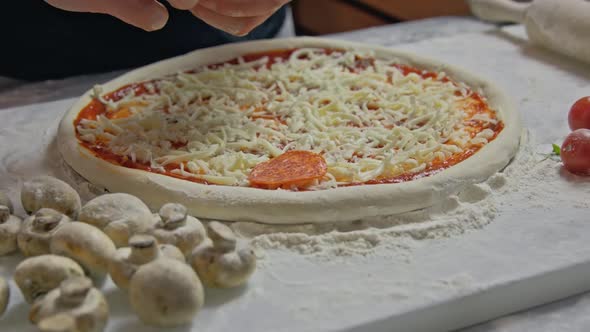 Professional Baker Prepares Traditional Italian Pizza alt