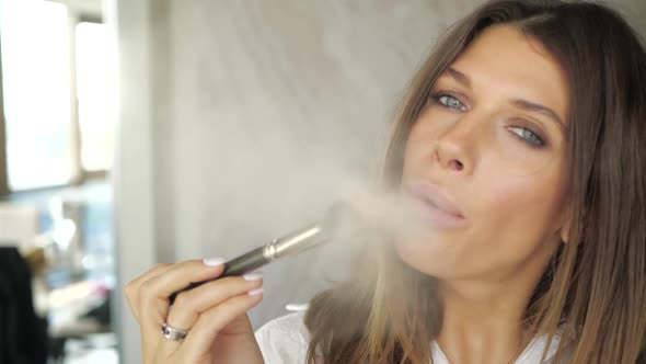 Attractive Girl Sensually Blows Powder From a Makeup Brush alt