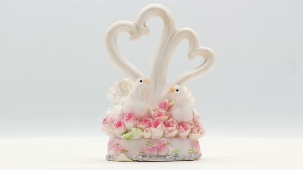 Two White Pigeons Statuette on White Background