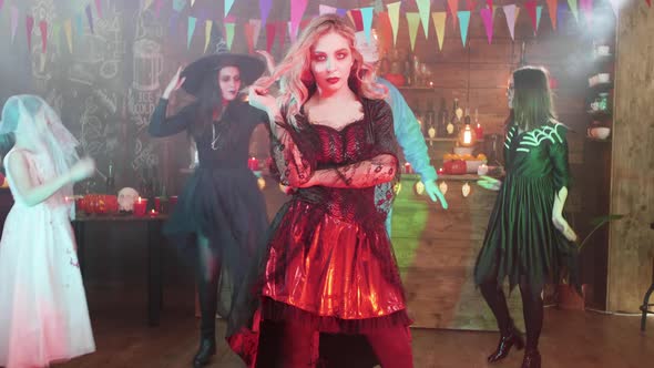 Young Beautiful Woman Dressed As a Vampiress Posing for the Camera at a Halloween Party alt