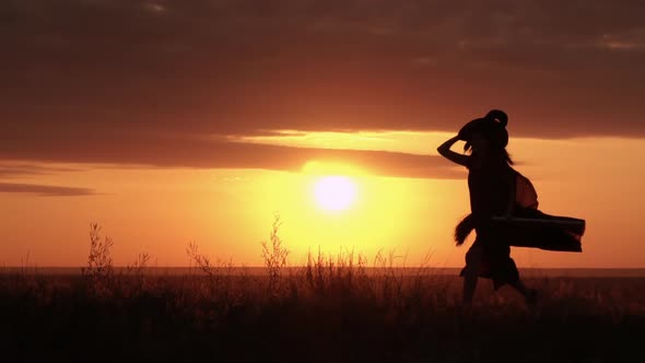 Sorceress with Besom Runs the Rays of the Sun Shine Through the Cloak alt