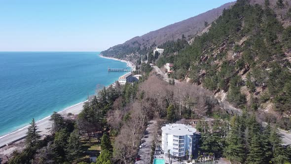 Mountains and sea. Lovely landscape. Blue sea water. Palm trees and sea. alt
