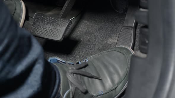 Accelerator and break pedal in a car. Close up the foot pressing foot pedal of a car to drive.