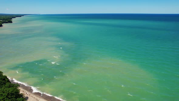 Spectacular Aerial drone video footage of beautiful Lake Erie during summer on a sunny day alt