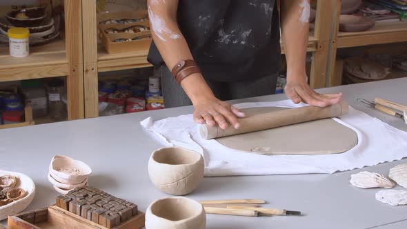 Woman Rolling Clay Craftsman Skill Concept. Art and Handicraft Modelling Creation. alt