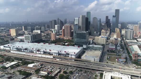This video is of an aerial view of downtown Houston skyline on a cloudy day. This video was filmed i alt