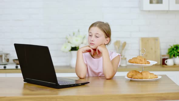 Girl Looking at Laptop alt