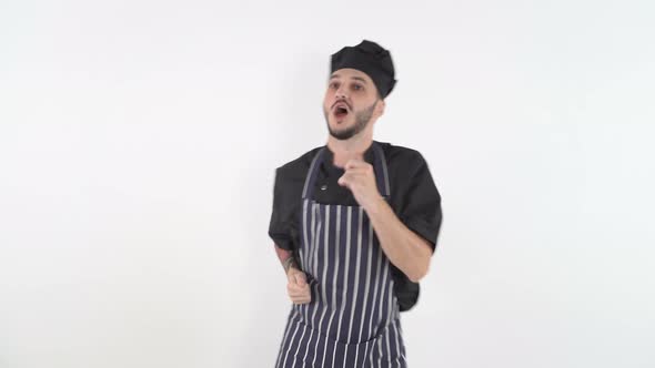 Happy Male Cook Dancing and Singing on White Background alt