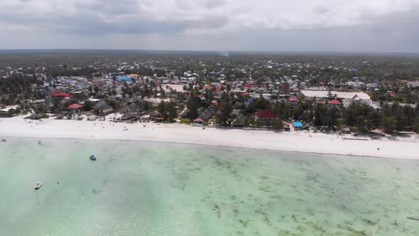 Ocean Coastline with Paradise Beach Hotels and Palm Trees Zanzibar Aerial View alt